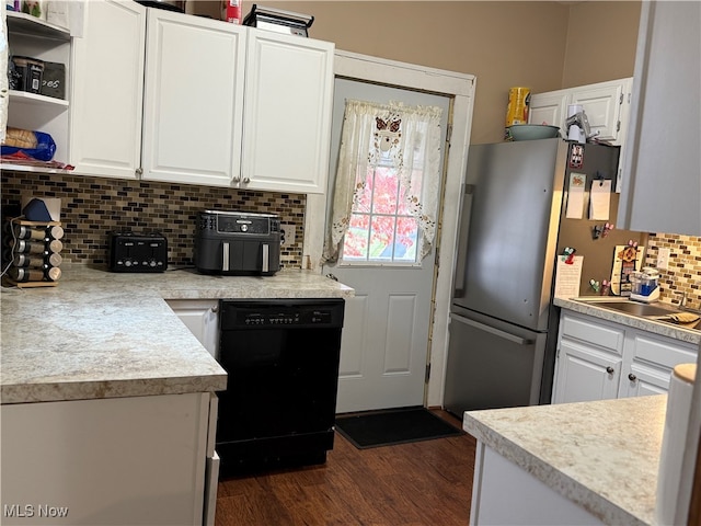 kitchen with dishwasher, sink, dark hardwood / wood-style flooring, white cabinets, and tasteful backsplash