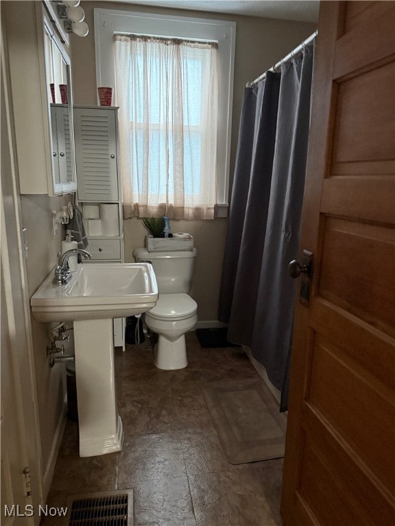 bathroom featuring toilet