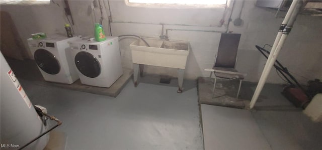 basement featuring sink and washer and clothes dryer