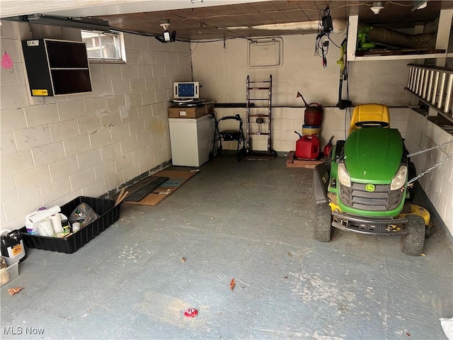 garage with concrete block wall