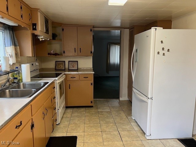 kitchen featuring tasteful backsplash, electric range, light tile patterned flooring, sink, and white refrigerator