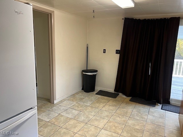 empty room with light tile patterned floors