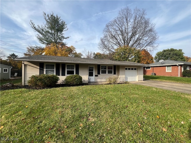 ranch-style house with a front lawn and a garage