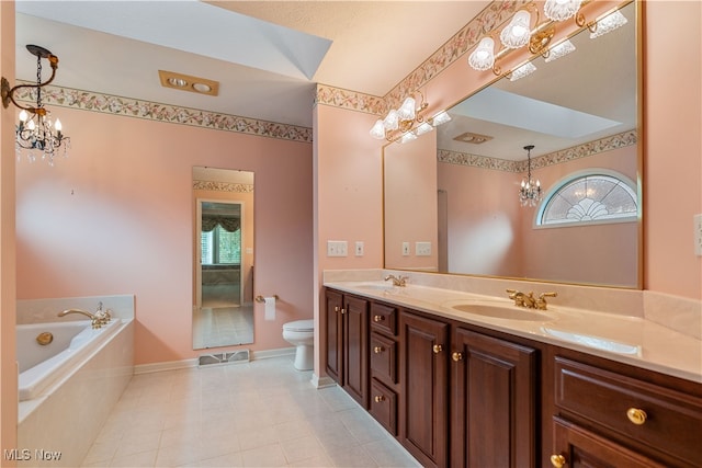 bathroom featuring vanity, toilet, tile patterned floors, and tiled tub