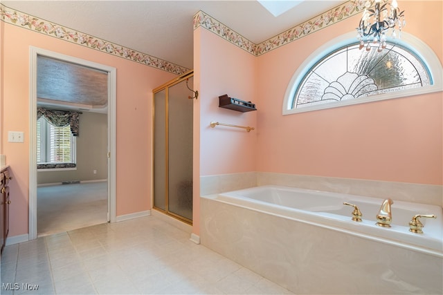 bathroom featuring vanity, independent shower and bath, and plenty of natural light