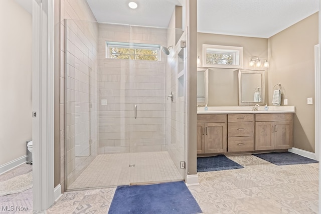 bathroom featuring toilet, tile patterned flooring, a healthy amount of sunlight, and walk in shower