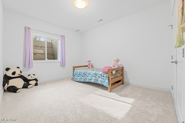 bedroom featuring light carpet