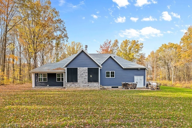 back of house with a yard