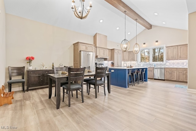 dining area featuring beam ceiling, high vaulted ceiling, a notable chandelier, and light wood-type flooring