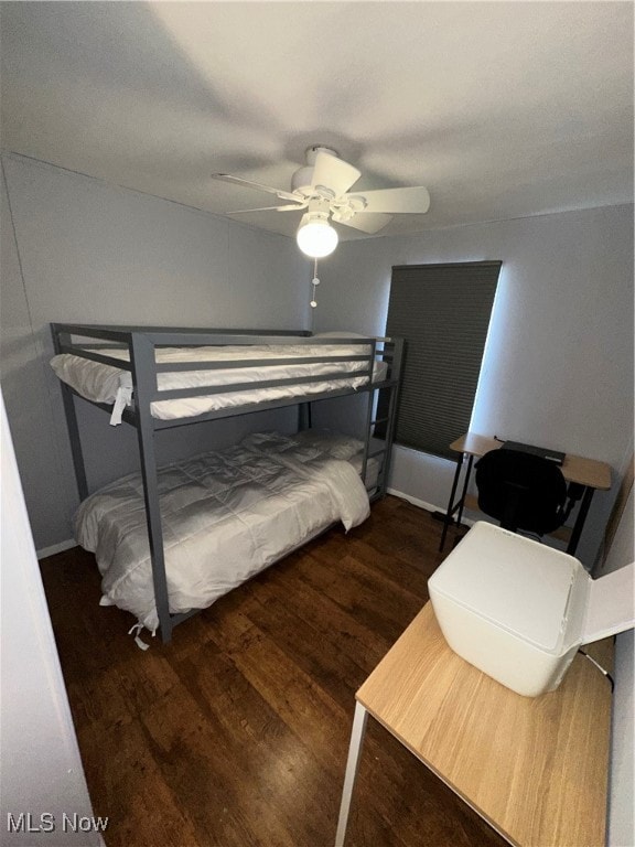 bedroom featuring dark wood-type flooring and ceiling fan