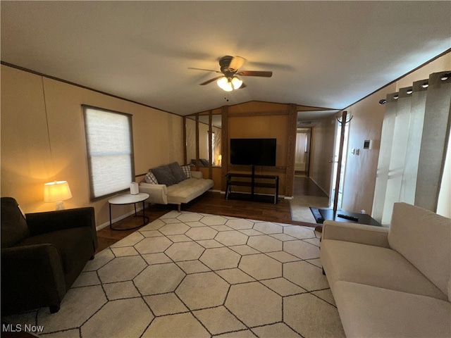 living room featuring lofted ceiling, ceiling fan, and wood-type flooring