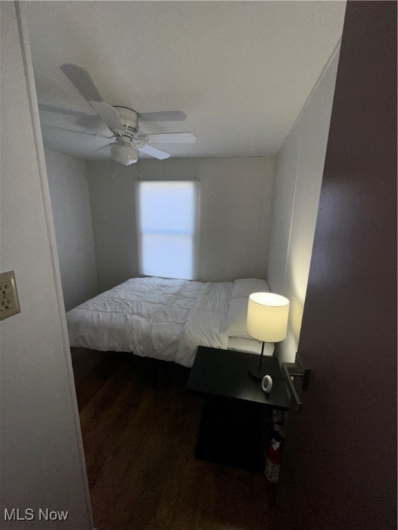 bedroom featuring hardwood / wood-style flooring and ceiling fan