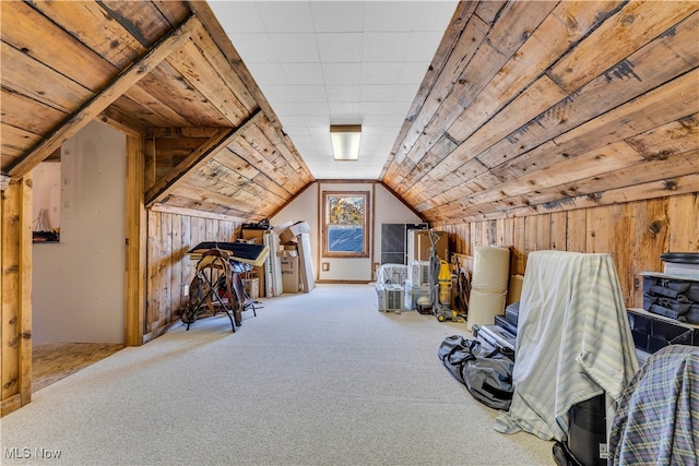 additional living space with wood walls, carpet floors, wood ceiling, and vaulted ceiling