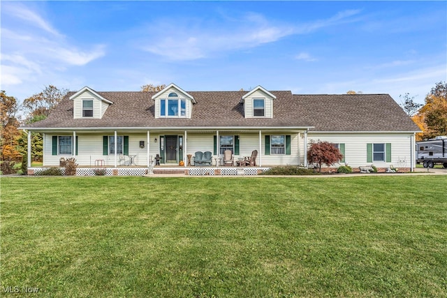 new england style home with a front yard and a porch