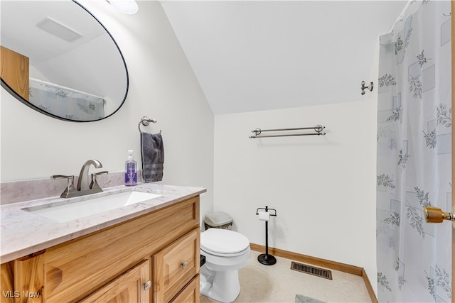 bathroom with vanity, a shower with shower curtain, lofted ceiling, and toilet