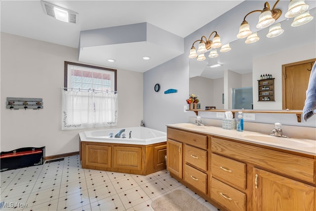 bathroom with vanity and independent shower and bath