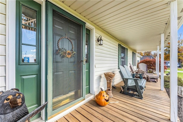 wooden terrace with a porch