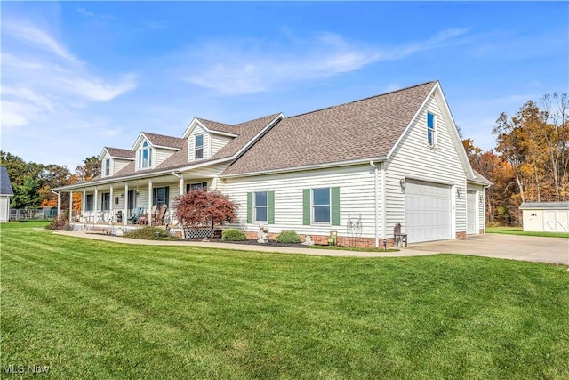 new england style home with a garage, covered porch, and a front yard