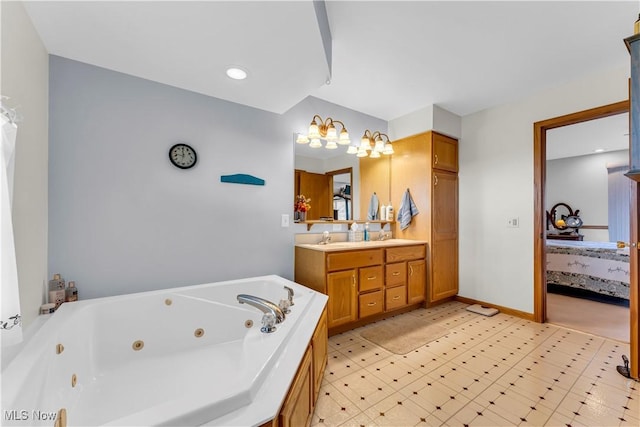 bathroom featuring vanity and a tub