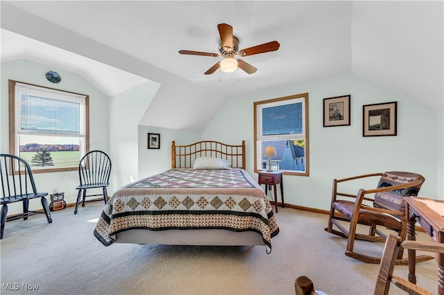 bedroom featuring ceiling fan, light carpet, and vaulted ceiling