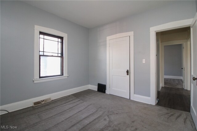 unfurnished bedroom with carpet flooring