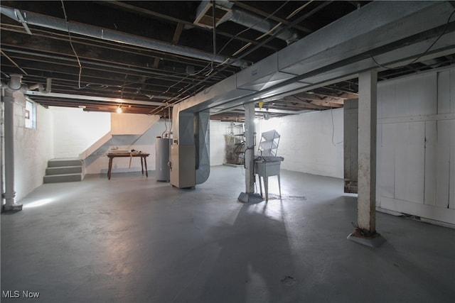 basement with heating unit and water heater