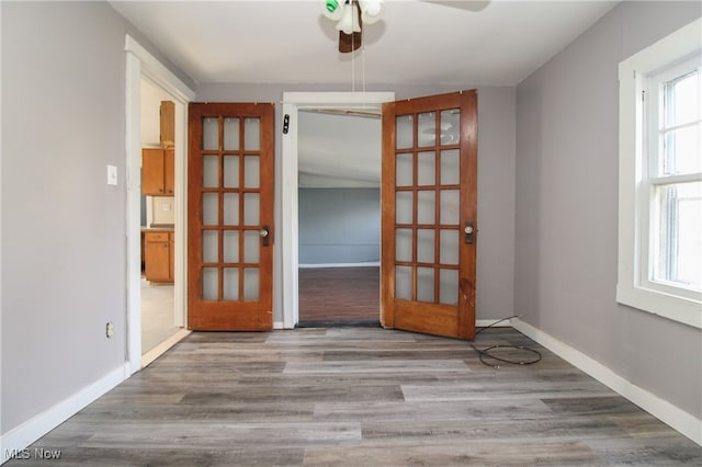 spare room with hardwood / wood-style floors and ceiling fan