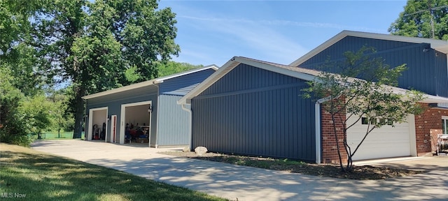 view of side of home with a garage