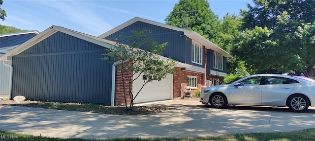 view of side of home with a garage