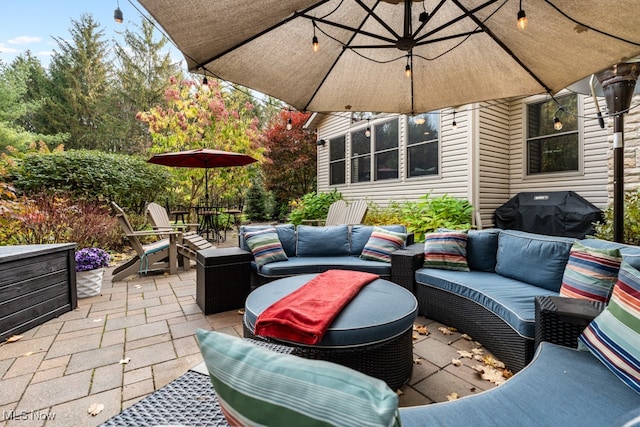 view of patio / terrace with an outdoor hangout area and a grill