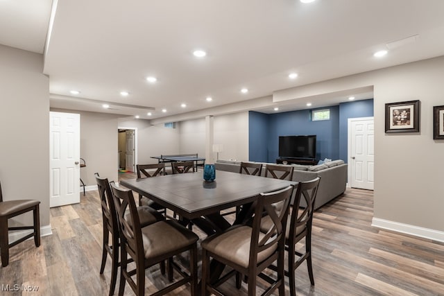 dining area with hardwood / wood-style flooring