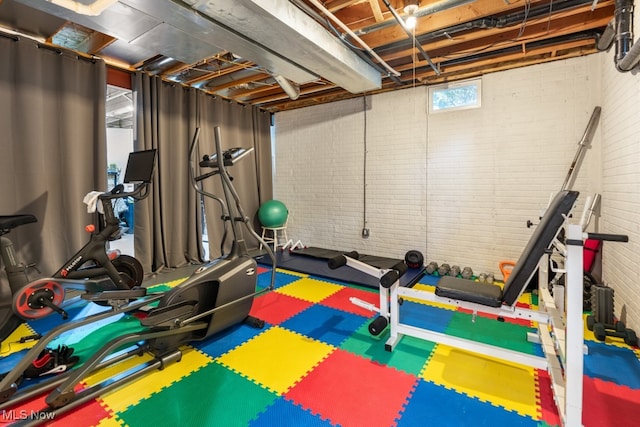 exercise area with brick wall