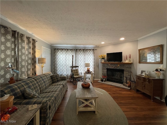 living room with crown molding, a textured ceiling, dark wood-type flooring, and a fireplace