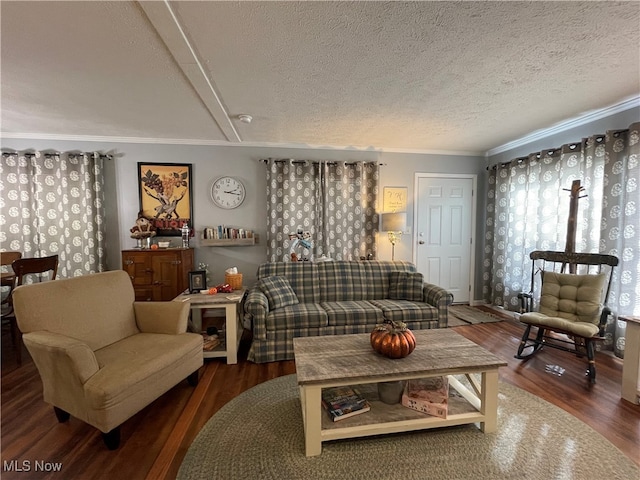 living room with ornamental molding, a textured ceiling, and dark hardwood / wood-style flooring