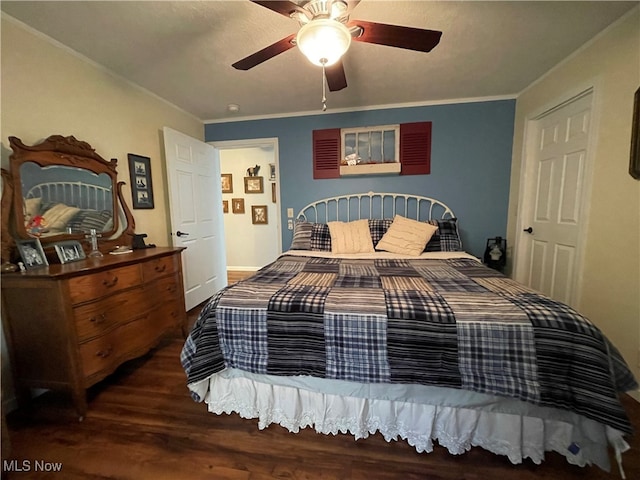 bedroom with dark wood-type flooring, ceiling fan, and ornamental molding