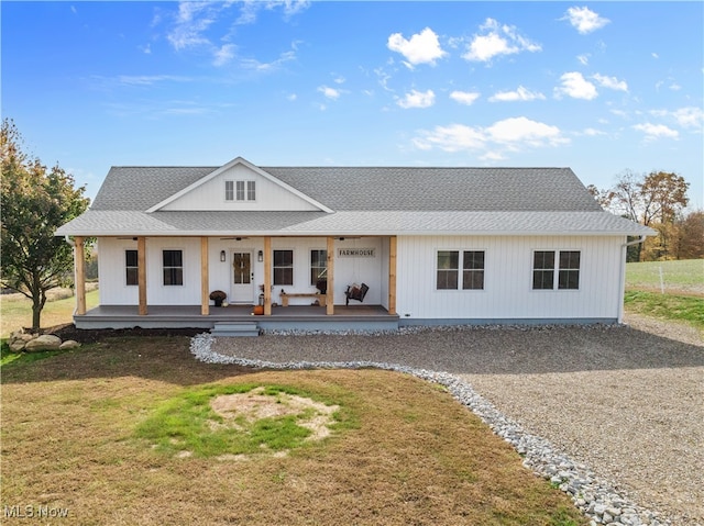 view of front of house with covered porch and a front yard