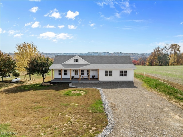 view of front of home featuring a front lawn and covered porch