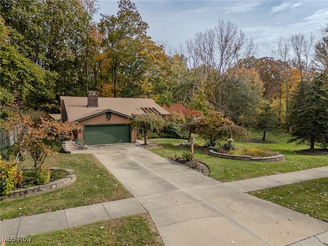 view of front facade with a garage and a front lawn