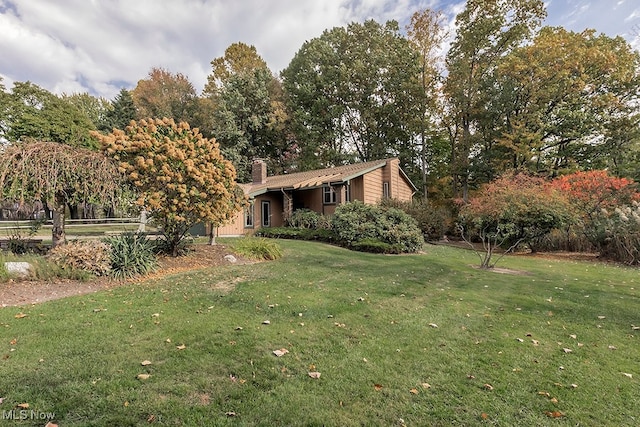 exterior space featuring a front yard