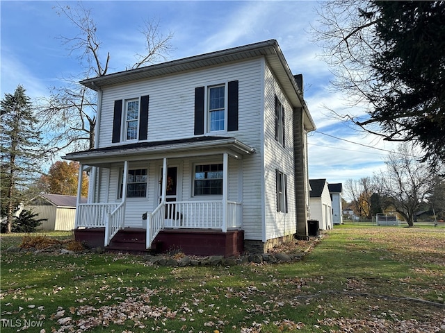 view of front of house featuring a porch and a front yard