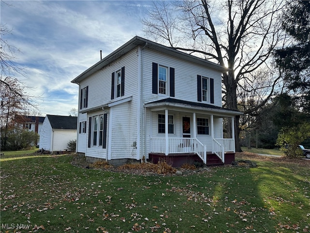 view of front of house with a front lawn and a porch