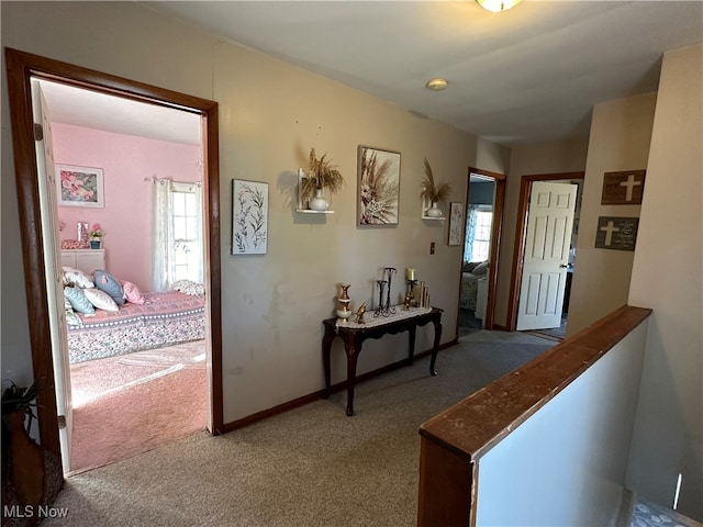 corridor with carpet flooring