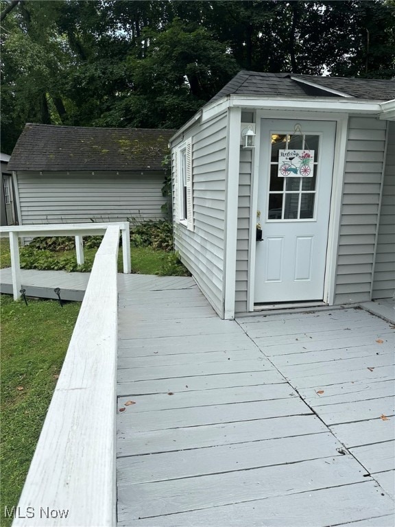 deck featuring an outdoor structure