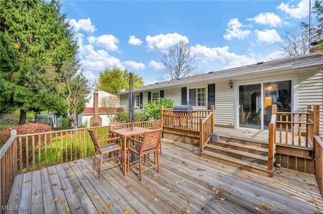 wooden deck with grilling area