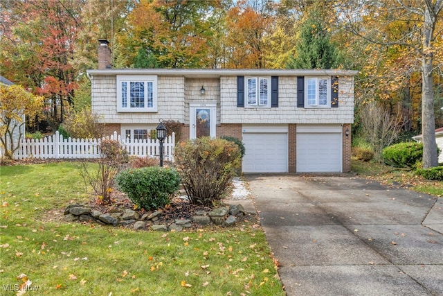 raised ranch featuring a garage