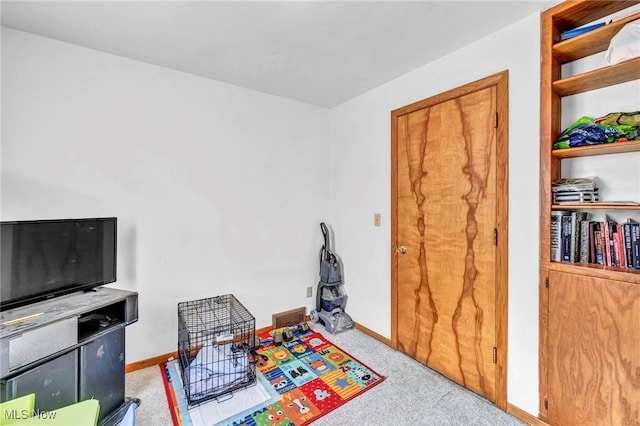 game room featuring light colored carpet