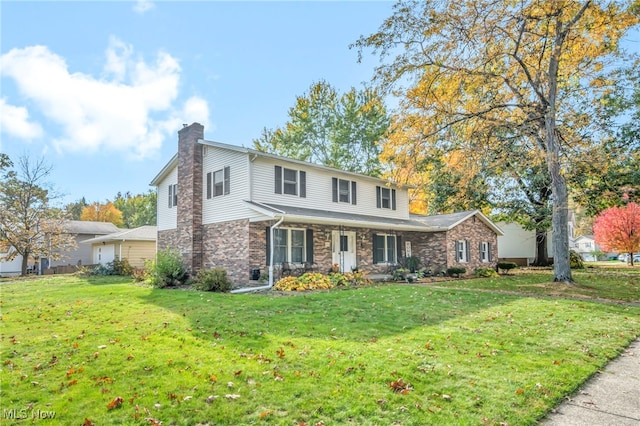 view of property featuring a front lawn