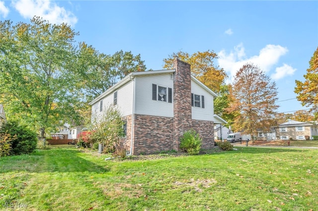 view of property exterior featuring a yard