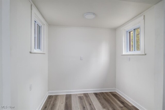 spare room with wood-type flooring