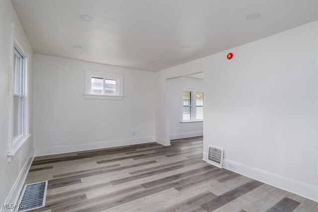 spare room with light wood-type flooring